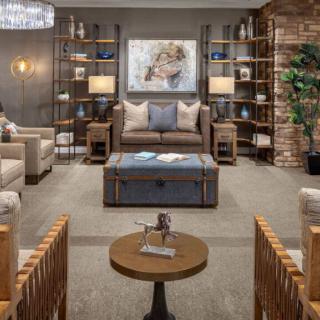 A stylish and cozy living room with modern furniture and decorative elements.