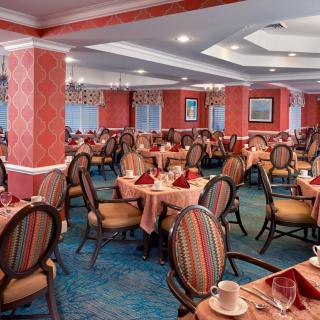 Elegant restaurant dining area with neatly arranged tables and chairs.