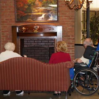 A warm gathering of seniors in a cozy living room setting.
