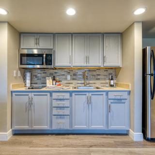A modern kitchen with stainless steel appliances and sleek cabinetry.