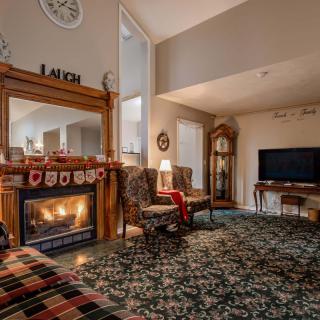 Cozy living room with a fireplace and traditional decor.