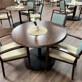 A stylish modern dining table set with four chairs, ideal for casual dining.