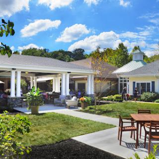 A serene outdoor space featuring landscaped gardens and well-designed architecture.