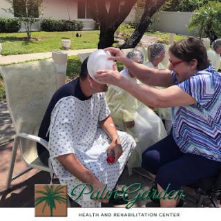 A caregiver provides assistance to a patient outdoors, showcasing the importance of support in healthcare.