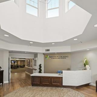 Modern reception area with a bright skylight and welcoming decor.