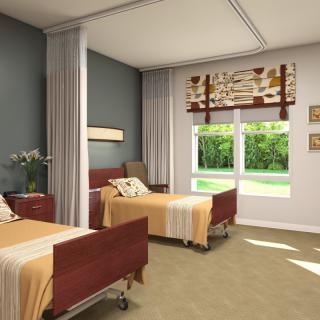 A hospital room with two beds, separated by curtains, featuring a large window and natural light.