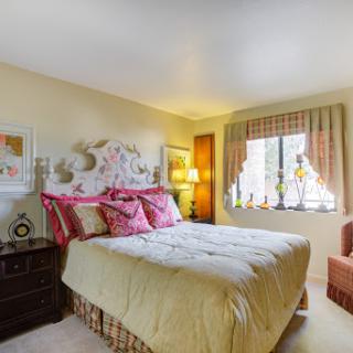 Cozy and inviting bedroom with warm colors and elegant decor.