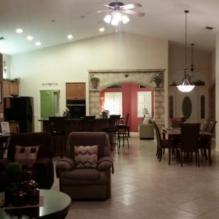 Spacious open floor plan with a cozy living room, dining area, and adjacent kitchen.
