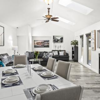 A contemporary open-concept living and dining area with modern furnishings and elegant decor.