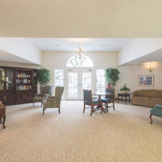 A spacious living room with elegant furniture and natural lighting.