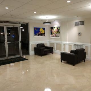 A modern lobby featuring comfortable seating and artistic decor.