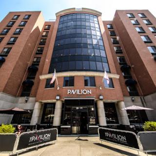 The modern facade of the Pavilion hotel, showcasing its contemporary design and welcoming entrance.