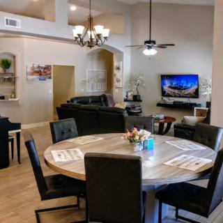A spacious and elegantly designed living and dining area with modern furnishings.