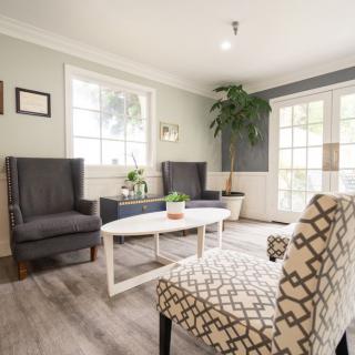 A cozy living room with stylish furniture and natural light.
