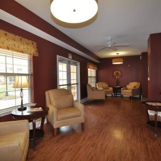 A cozy seating area with comfortable chairs and warm lighting.