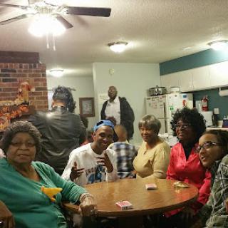A fun evening with friends and family gathered around a table, enjoying games and good company.