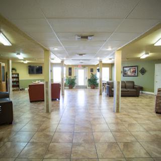 A spacious community lounge featuring comfortable seating and a welcoming atmosphere.