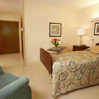 A cozy and well-lit bedroom with stylish decor.