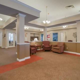 A spacious lobby area featuring comfortable seating and ambient lighting.