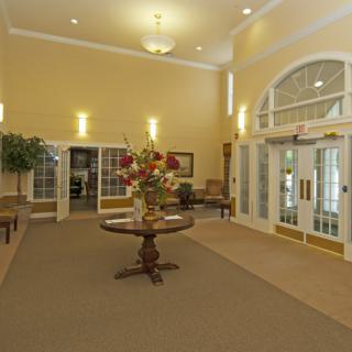 A spacious lobby area with elegant decor and lighting.