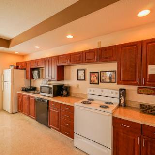 A well-equipped kitchen featuring wooden cabinets and modern appliances.