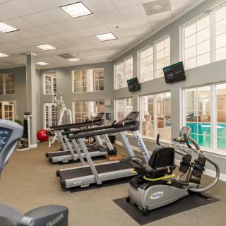 A well-equipped indoor gym featuring treadmills and exercise machines.