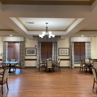 A cozy dining area designed for comfort and relaxation, featuring elegant decor and ample natural light.
