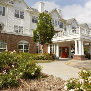 A beautifully landscaped residential building with a welcoming entrance.
