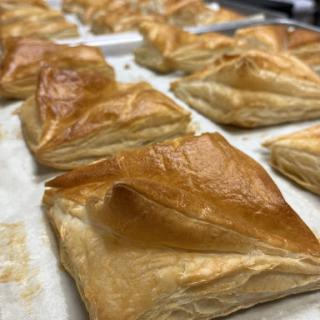Freshly baked flaky pastries ready to be enjoyed.