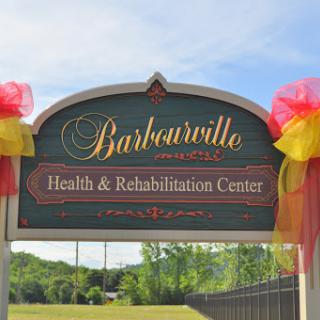 Sign for the Barboursville Health & Rehabilitation Center, decorated with colorful bows.
