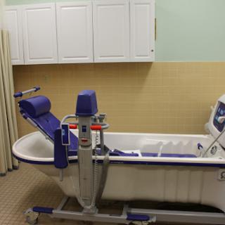 A hydrotherapy tub set up for rehabilitation purposes in a medical facility.