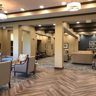 A modern lobby with comfortable seating and elegant lighting.