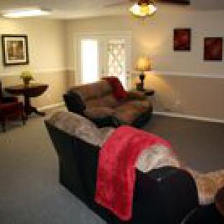A cozy living room with a sofa and decorative elements.