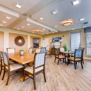 A modern dining area with elegant furniture and bright lighting.