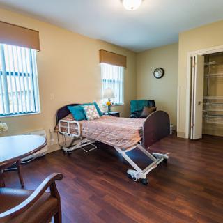A well-furnished hospital room designed for comfort and care.