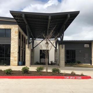 Modern building entrance with a distinctive awning.