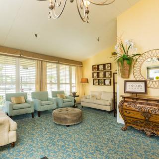 A cozy living room with comfortable seating and elegant decor.