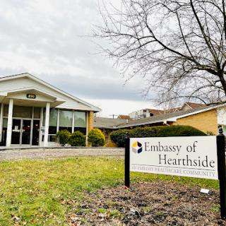 The Embassy of Hearthside, featuring a welcoming entrance and landscaped surroundings.