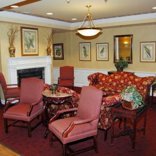A cozy living room with elegant furniture and a fireplace.