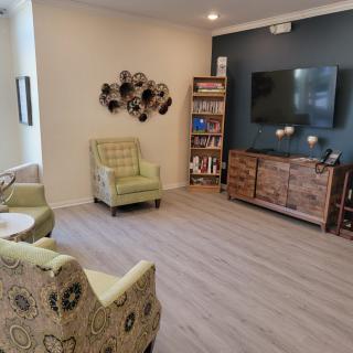 A cozy living room with comfortable seating and a TV.