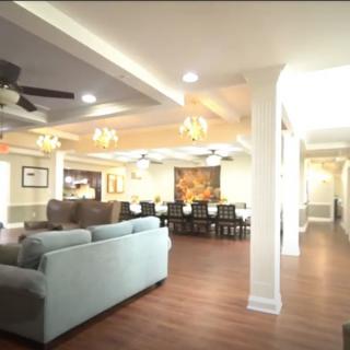 Spacious and elegantly designed living area with a comfortable seating arrangement and an adjoining dining space.