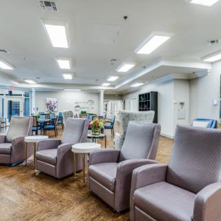 A modern and spacious waiting area with comfortable armchairs.