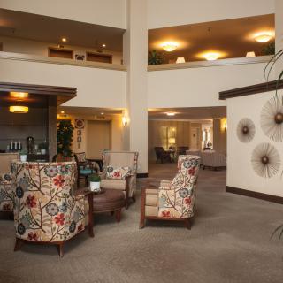 A cozy hotel lobby with plush seating and elegant decor.