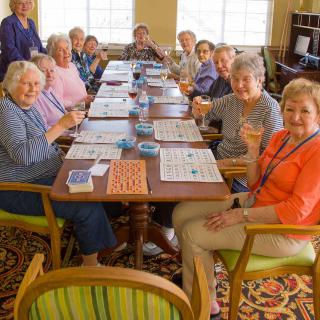 A group of seniors enjoying a lively game of bingo together.