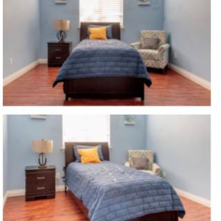 A cozy, neatly arranged bedroom with a single bed, nightstand, chair, and lamp.