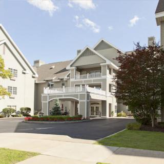 A modern apartment complex with a neatly maintained exterior and landscaping.