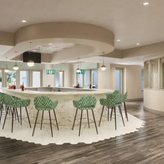 A modern bar area with elegant seating and stylish lighting.