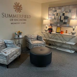 A cozy and modern lobby area featuring stylish seating and decorative elements.