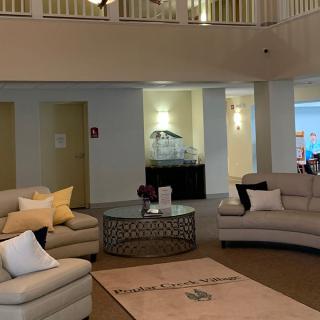 A modern and cozy living room with comfortable seating and stylish decor.