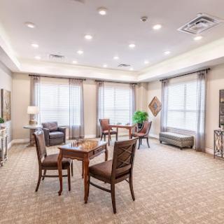 A cozy lounge area featuring comfortable seating and warm lighting, perfect for relaxation or socializing.